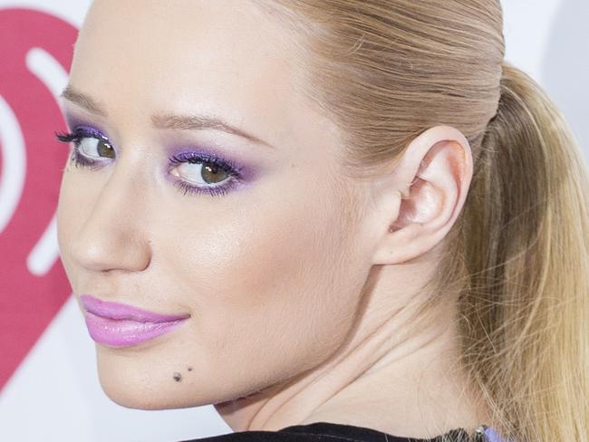 Iggy Azalea arrives at the iHeart Radio Music Festival, Saturday Sept. 20, 2014, at The MGM Grand Garden Arena in Las Vegas. (Photo by Andrew Estey/Invision/AP)