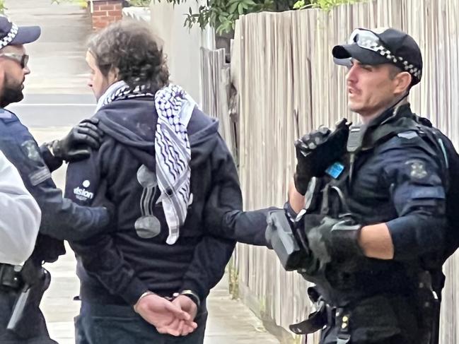 A man was restrained by police outside the Caulfield Hebrew Congregation.