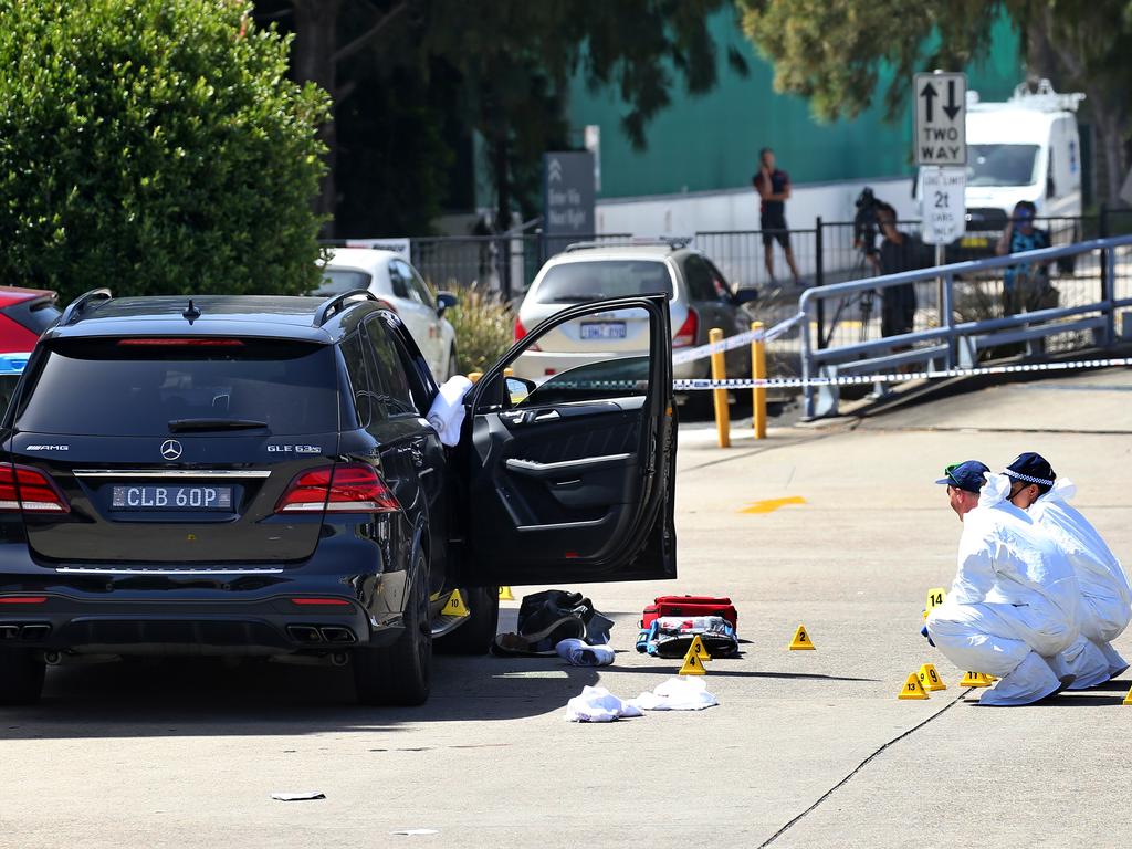 Forensics officers examine the scene and collect evidence. Picture: Toby Zerna