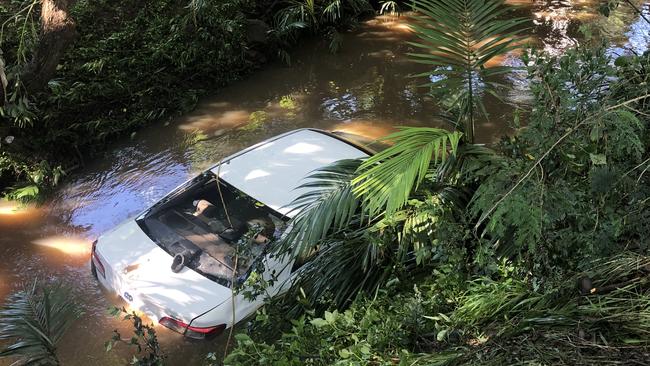 A woman was killed after the car she was in was washed away in floodwaters into a creek at Aspley. Picture: Tara Croser