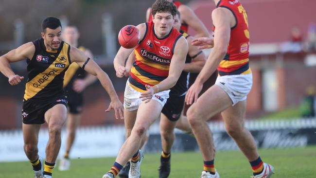 Crows Magarey Medal fancy Harry Schoenberg fires out a handpass against Glenelg. Picture: Cory Sutton/SANFL