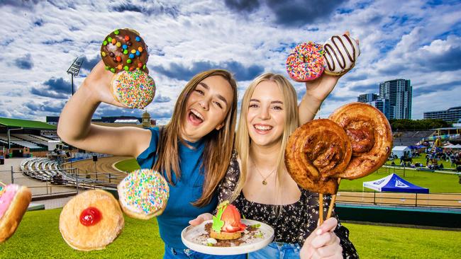 Kimmy Balmer and Allana Acton with a Bacon Lollipop, strawberry dessert and new Ekka doughnuts. Picture: Nigel Hallett