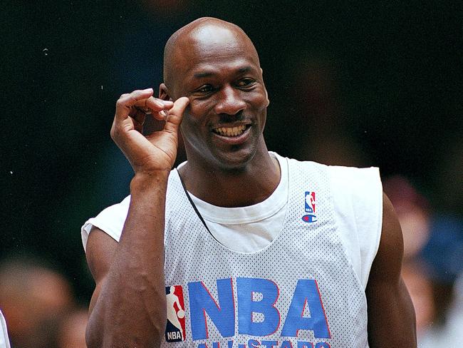 9 Feb 1997: Michael Jordan #23 of the Chicago Bulls smiles on the court during the NBA All-Star Practice at the Gund Arena in Cleveland, Ohio.The East defeated the West 132-120 .