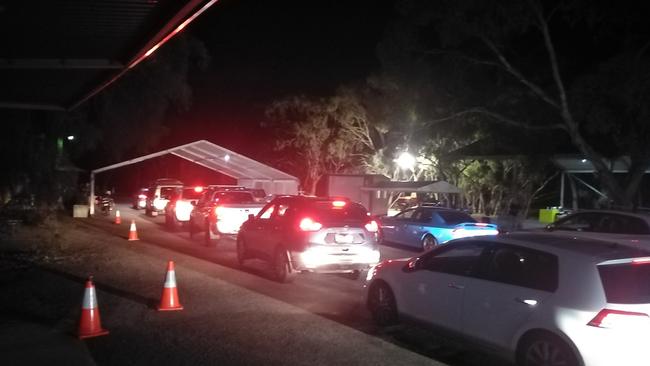 A long line of cars queue up at the SA border.