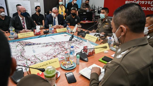 Australian ambassador to Thailand Allan McKinnon (second left at table) and Thailand's Police Lieutenant General Surachate Hakparn (second right at table) at the Bophut Police Station in Koh Samui, Thailand, on Monday night. Picture: Getty Images