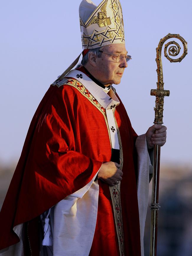 Cardinal George Pell walks onto the stage for the opening mass for World Youth Day in Sydney in 2008. Picture: AP Photo/Rick Rycroft