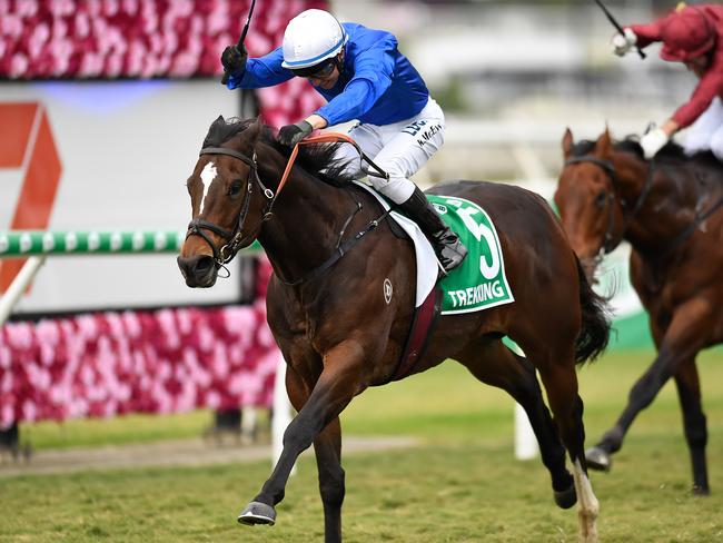 Jockey Kerrin McEvoy rides Trekking to victory in race 8, the Stradbroke Handicap, during Stradbroke Day at Eagle Farm Racecourse in Brisbane, Saturday, June 8, 2019. (AAP Image/Albert Perez) NO ARCHIVING, EDITORIAL USE ONLY