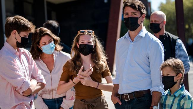 Justin Trudeau arrives with his family to cast his vote. Picture: AFP.