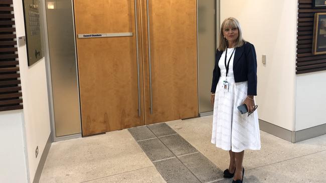 Deputy Mayor Donna Gates chooses not to take part in a debate at the Gold Coast City Council meeting, standing outside the Evandale chamber.