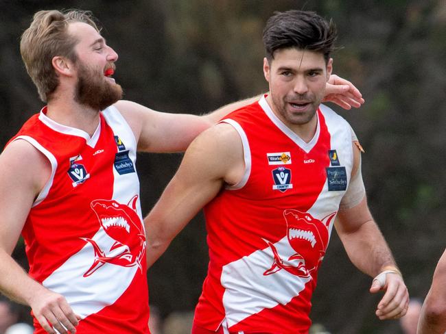 Peninsular football league club Sorrento versus Frankston at Sorrento. A look behind the scenes of the day. Sorrento's Leigh Poholke congratulates Chris Dawes on his goal.Picture: Jay Town