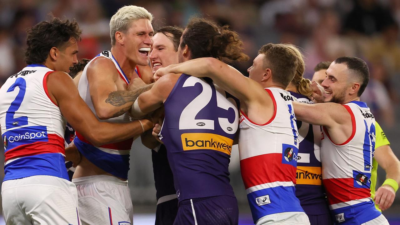 PERTH, AUSTRALIA - APRIL 21: Alex Pearce of the Dockers and Rory Lobb of the Bulldogs wrestle before the first bounce during the round six AFL match between Fremantle Dockers and Western Bulldogs at Optus Stadium, on April 21, 2023, in Perth, Australia. (Photo by Paul Kane/Getty Images)