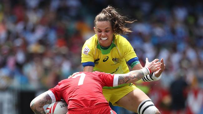 Australia's Chloe Dalton tackles Canada's Jennifer Kish during the HSBC World Rugby Women's Sevens Series semi-final at Allianz Stadium, Sydney. Picture: Brett Costello