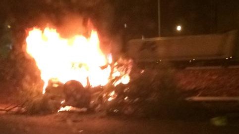 Emergency crews rushed to a Mitsubishi Triton engulfed in flames in West Mackay. Picture: Luke Hughes