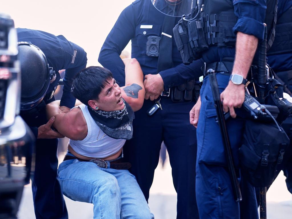 A protester is detained in downtown Los Angeles. Picture: AP