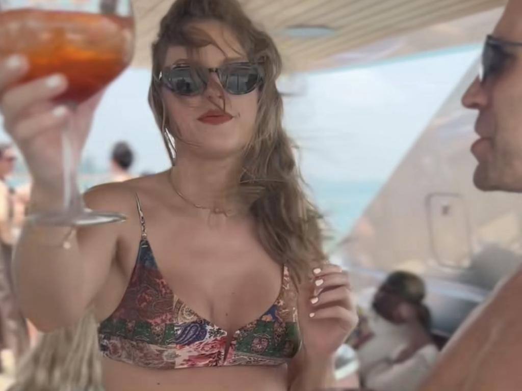Travis Kelce kisses Taylor Swift in intimate home video.