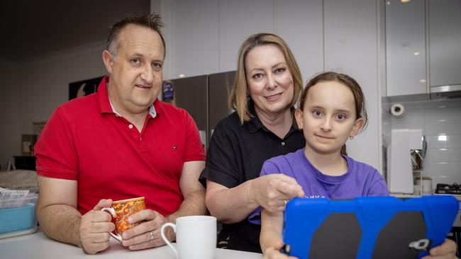 Michael, Samantha, and Eva Astachnowicz at their home in Campbelltown. Picture: Emma Brasier