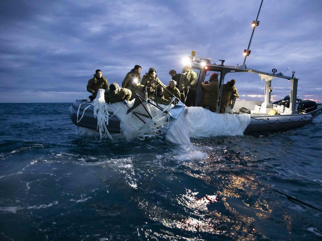 US Navy Sailors assigned to Explosive Ordnance Disposal Group 2 recover a high-altitude surveillance balloon off the coast of Myrtle Beach, South Carolina. Picture: Supplied