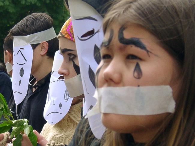 Young people stage a protest against violence in Uzbekistan, as they stand outside the Uzbek Embassy in Bishkek, Kyrgyzstan 19 May 2005.