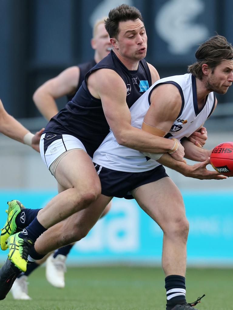 Vic Country’s Jason Cole and VAFA’s Tom Paule at Ikon Park, Carlton. Picture: Yuri Kouzmin