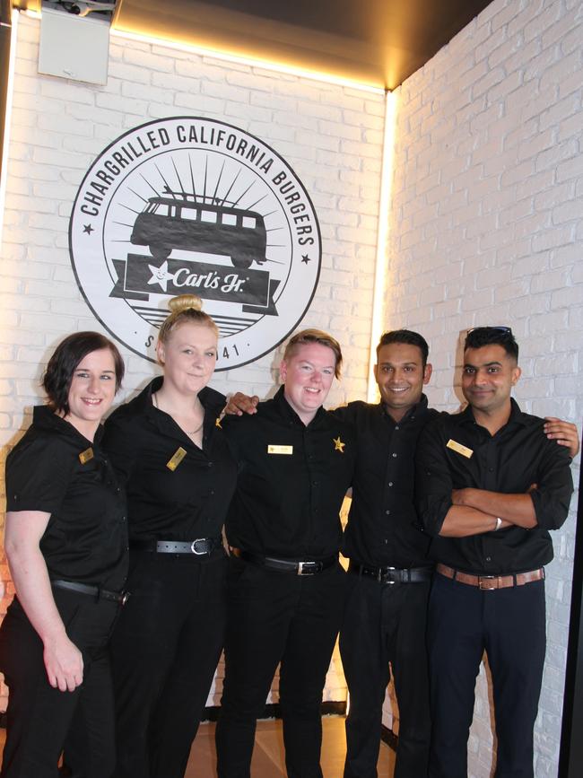 Carla Robertson-McIlwain, Krystal Sanson, Jacinta Pearson, Jikin Patel and Suri Singh are all managers at the new Carl's Jr Rothwell opening on December 13. Picture: Erin Smith