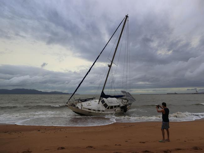 Townsville locals including Dr Deepak Doshi woke early to inspect the damage along The Strand left from TC Kirrily that hit overnight. Pics Adam Head