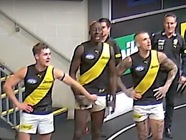 Richmond players are seen groping Mabior Chol during team song in the rooms.