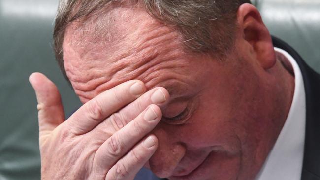 Australian Deputy Prime Minister Barnaby Joyce reacts during House of Representatives Question Time at Parliament House in Canberra, Monday, February 12, 2018.  (AAP Image/Lukas Coch) NO ARCHIVING