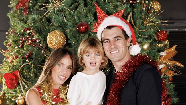 WARNING FOR PRINT 24/12/24 no online till 6PM WARNING MELBOURNE, AUSTRALIA  December 23, 2024: Pat Cummins with wife Becky and son Albie getting into the Christmas spirit in Melbourne before the Aussies take on India in the Boxing Day test at the MCG on Thursday. Picture : David Geraghty