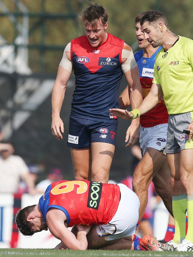 Aaron vandenBerg stands over Lachie Neale. Picture: Michael Klein