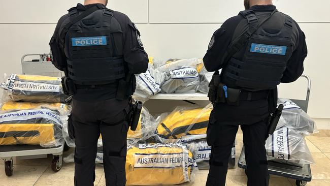 Police after seizing the massive haul which was allegedly retrieved by three men from a tanker off Gladstone. Picture: AFP