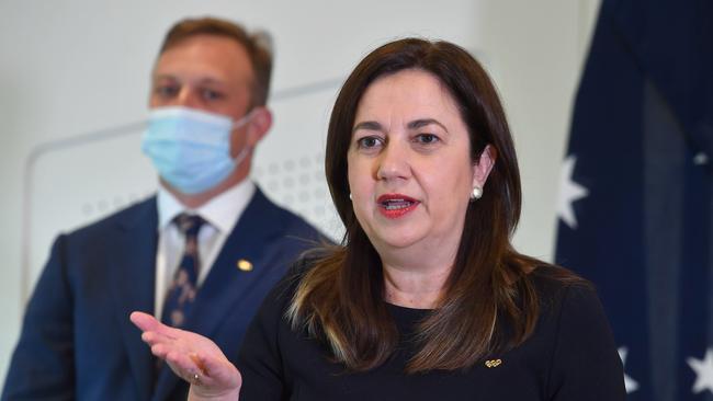 Premier Annastacia Palaszczuk provides a COVID update with Deputy Premier Steven Miles at back. Picture: NCA NewsWire / John Gass