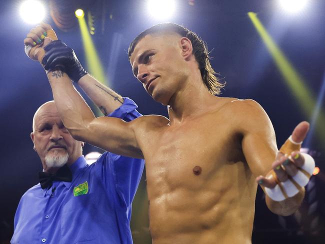 SYDNEY, AUSTRALIA - DECEMBER 22: Harry Garside on professional debut wins his fight against Sachin Mudaliar during their Footy Fight Night Christmas Bash lightweight bout at The Star on December 22, 2021 in Sydney, Australia.  (Photo by Mark Evans/Getty Images)