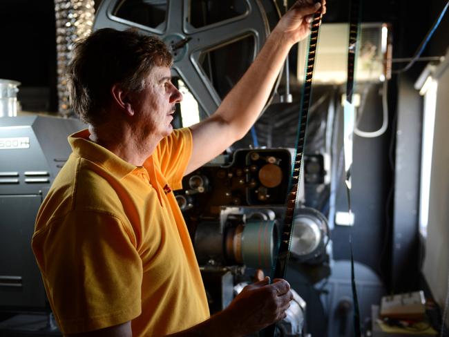 Dromana Drive-in operator Paul Whitaker with an old film projector … the National Trust of Australia (Victoria) classified the drive-in in 2007.