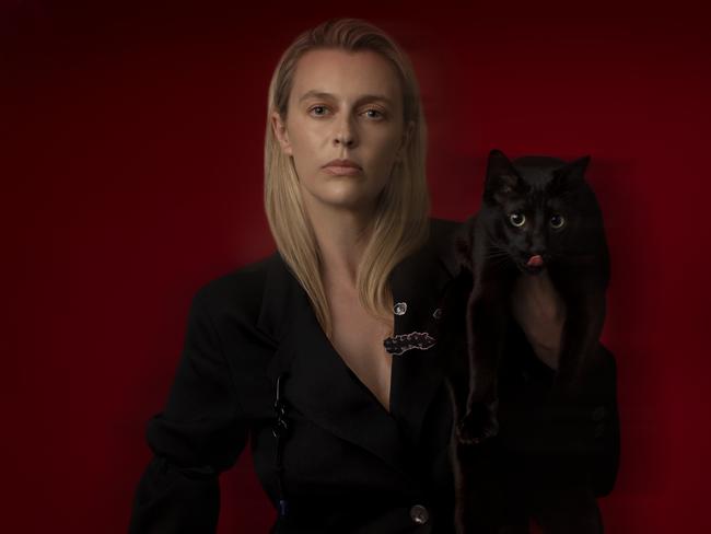 EMBARGO FOR TWAM 6 NOV 2021 FEE APPLIES, Gracie Otto, photography Alina Gozin'a, Hair and makeup Kimberley Forbes, Styling Karla Clarke, Clothes : Michael Lo Sordo blazer and trousers, Song For the Mute blazer and pants (pic with cat), (close up) The Frankie Shop top, Cat :Black cat is called Anubis @, Romeo.and.Anubis , Handler Taylor Fezai, Cat harness by Blue Pet Boutique cat accessories