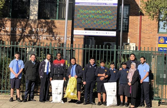 Punchbowl Boys High School principal Robert Patruno with students and science teacher Mariam Sabih English teacher Francis Floresca. Picture: Lawrence Machado