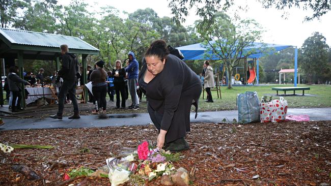 Mourners at a vigil for Nicole Cartwright at Buffalo Creek Reserve Playground. Picture: Adam Yip/Manly Daily