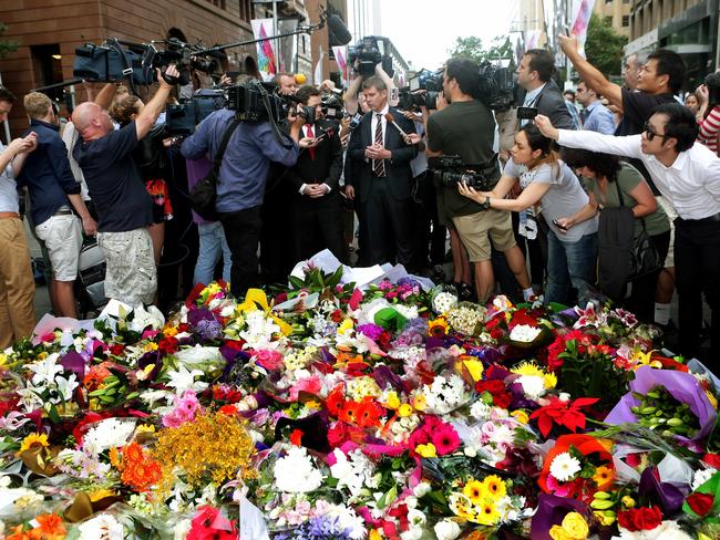 The media swamps Premier Mike Baird. Picture: Adam Ward