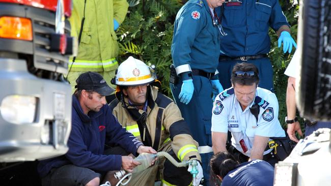 Emergency services at a two-car fatal accident between a taxi and a car on the south bound lanes of he Gold Coast Highway.