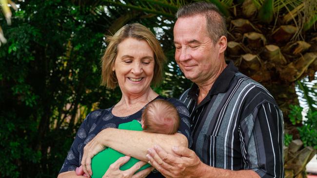 Emergency foster care workers Gina and Cole Young with a nine day-old newborn baby who was placed in their care last week. Picture: Justin Lloyd