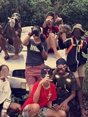 Cairns teens pose in front of an allegedly stolen car on Instagram.