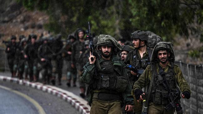 Israeli army soldiers patrol an undisclosed area in northern Israel bordering Lebanon on October 15, 2023. Picture: AFP