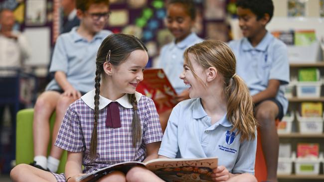 The Catalyst program of direct instruction in Catholic schools in Canberra and Goulburn has helped Year 5 students Elodie (L) and Faith, from St Thomas Aquinas Primary School in Canberra. Picture: Martin Ollman