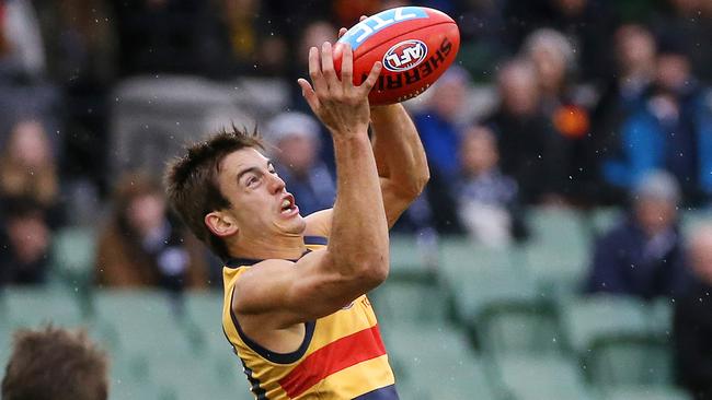 Adelaide's Jarryd Lyons takes a mark. The out-of-contract midfielder has been offered to Carlton in a deal for Bryce Gibbs.