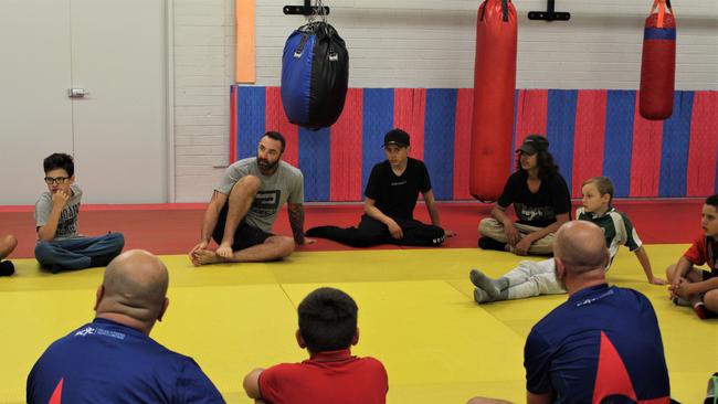 The kids sit and chat following a morning of fitness as part of the Youth Active Rewards Program.