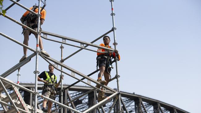 Workers from Stageset erecting a New Year’s Eve projection tower at Hickson Road Reserve, it will be used for projections onto the Harbour Bridge. AAP.