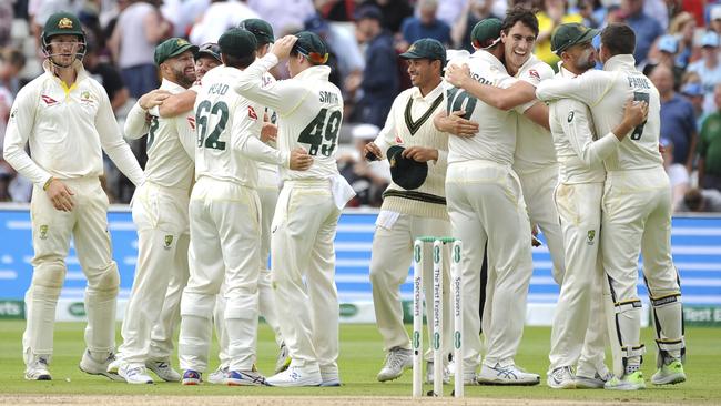 Australia’s players celebrate after beating England by 251 runs in the first Test. Picture: AP