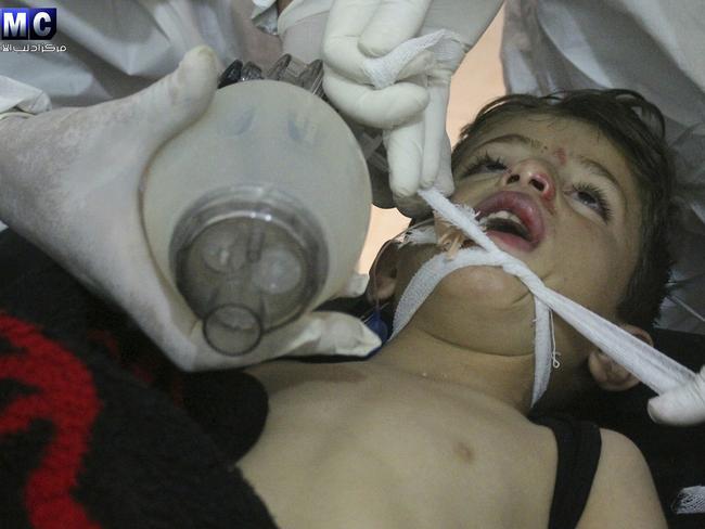 A child receives medical treatment following the attack which the Edlib Media Center said was among the worst in the country’s six-year civil war. Picture: Edlib Media Center/AP