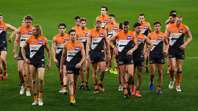 The Giants leave the field after being thumped by cross-town rival Sydney. Picture: Daniel Carson/AFL Photos via Getty Images