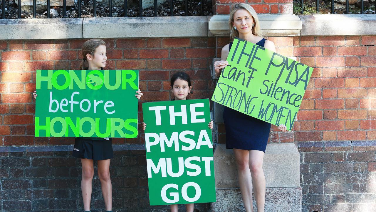 Liz Washington and her children Rose Sharp, then 11 and Pearl Sharp, then eight, at the Somerville House protests in 2017. Picture: AAP/Claudia Baxter.