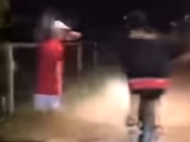 A video posted to a southern Gold Coast Facebook community page has shown the moment two boys conspire to throw a can of “piss” onto an innocent person who they ride past. Photo: Facebook